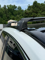 Roof rack system on a car with trees in the background